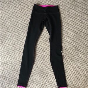 Lululemons reversible black / neon pink leggings